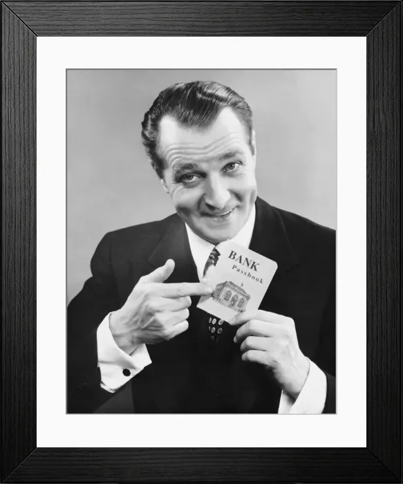 Framed Print : Man holding bank book