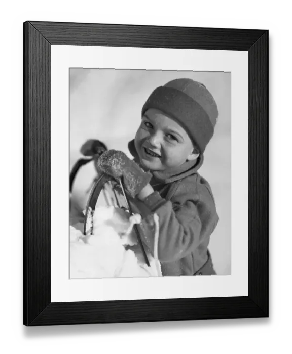 Framed Print : Boy with sled in snow Framed Print : Boy with sled in snow