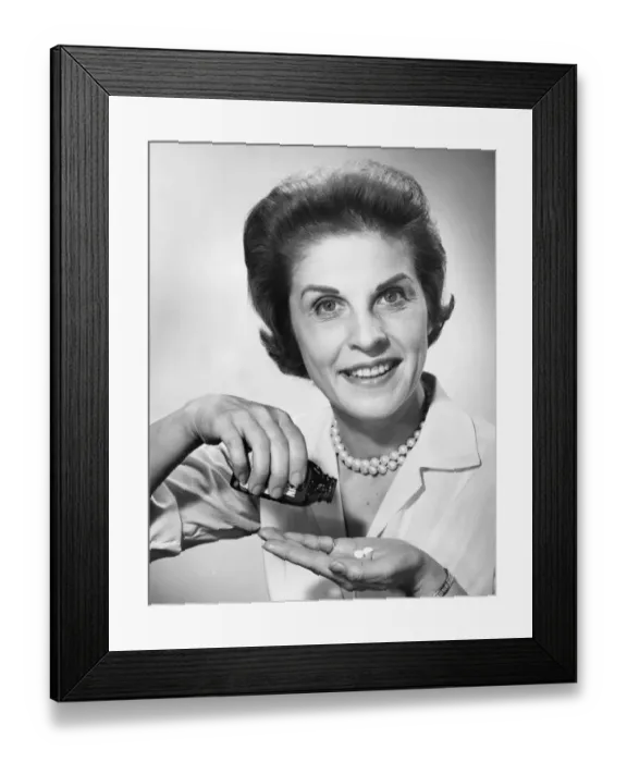 Framed Print : Woman pouring pills from bottle Framed Print : Woman pouring pills from bottle