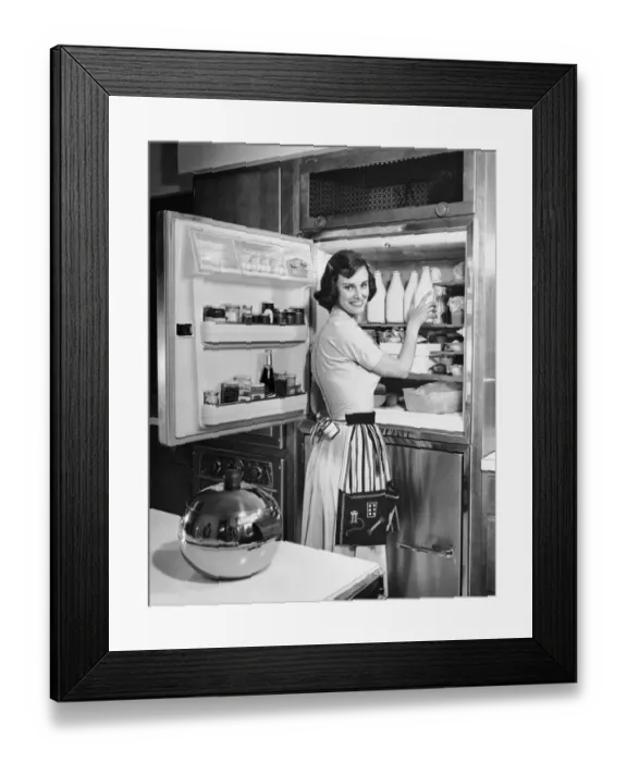 Framed Print : House wife removing milk from refrigerator