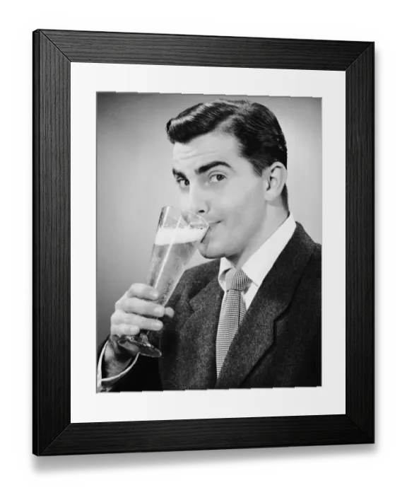 Framed Print : Man in suit drinking tall glass of beer Framed Print : Man in suit drinking tall glass of beer