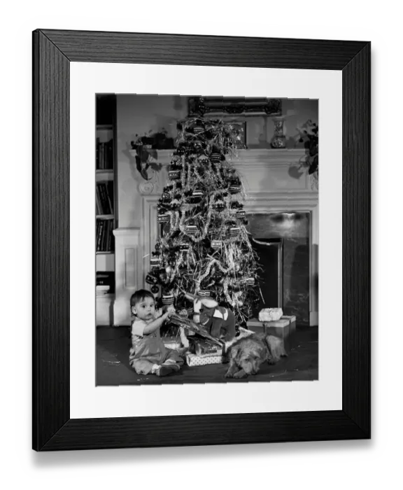 Framed Print : Baby beside a Christmas tree Framed Print : Baby beside a Christmas tree