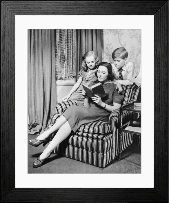 Framed Print : Mother reading to daughter & son