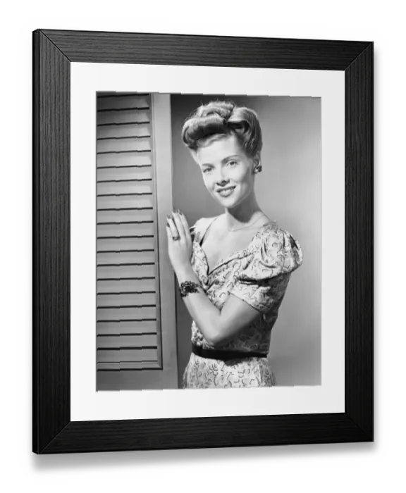 Framed Print : Indoor portrait of woman in door way Framed Print : Indoor portrait of woman in door way