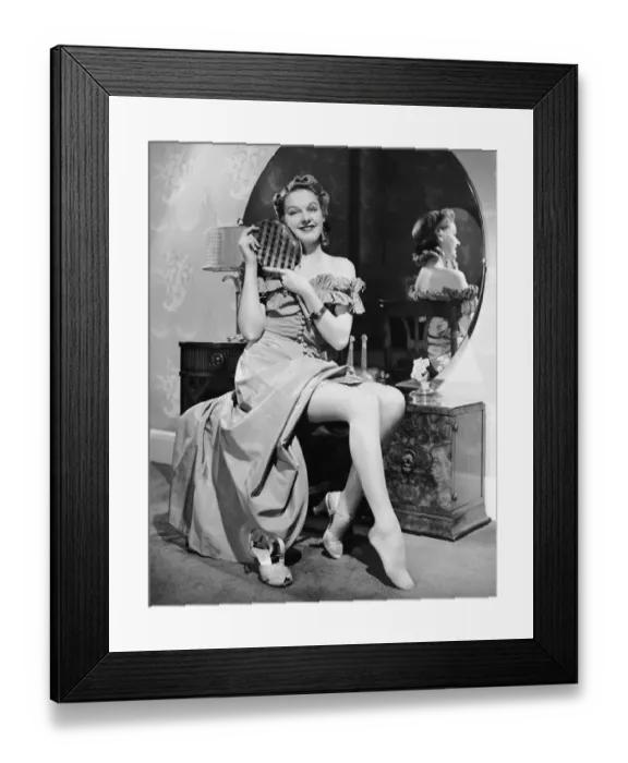 Framed Print : Woman at dressing table holding mirror Framed Print : Woman at dressing table holding mirror
