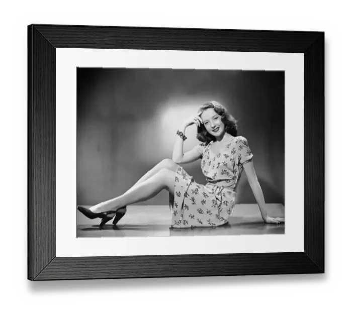 Framed Print : Woman sitting on table top Framed Print : Woman sitting on table top