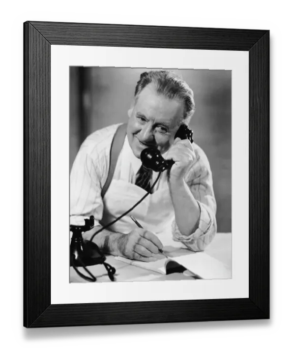 Framed Print : Grocer taking order over phone Framed Print : Grocer taking order over phone
