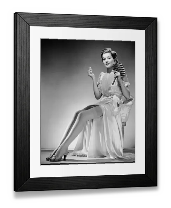 Framed Print : Portrait of woman holding mirror and powder puff