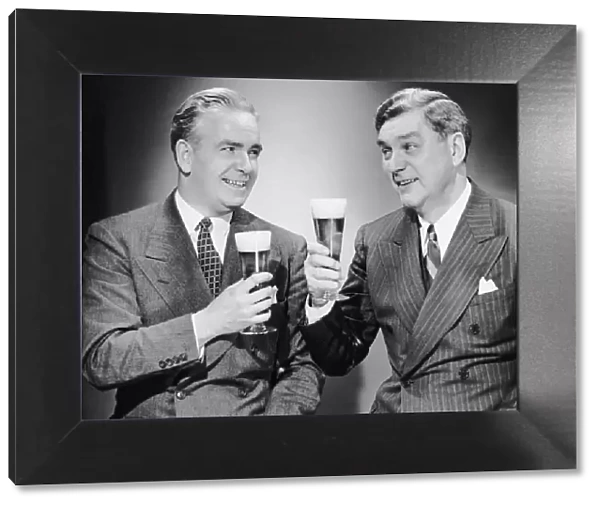 Two men with alcoholic beverages