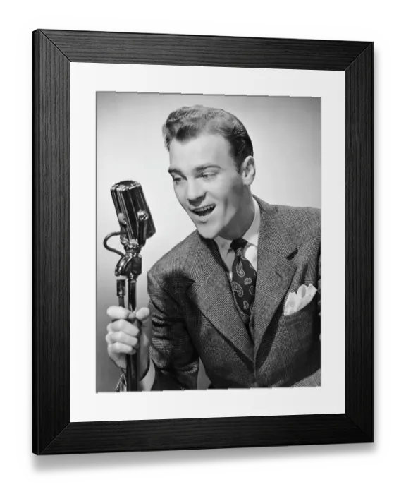 Framed Print : Male singer holding microphone Framed Print : Male singer holding microphone