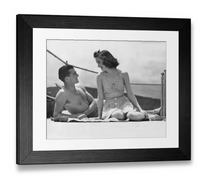 Framed Print : Couple relaxing on a sailboat Framed Print : Couple relaxing on a sailboat