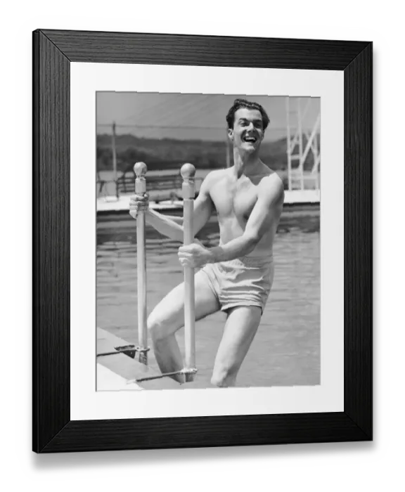 Framed Print : Man entering swimming pool Framed Print : Man entering swimming pool