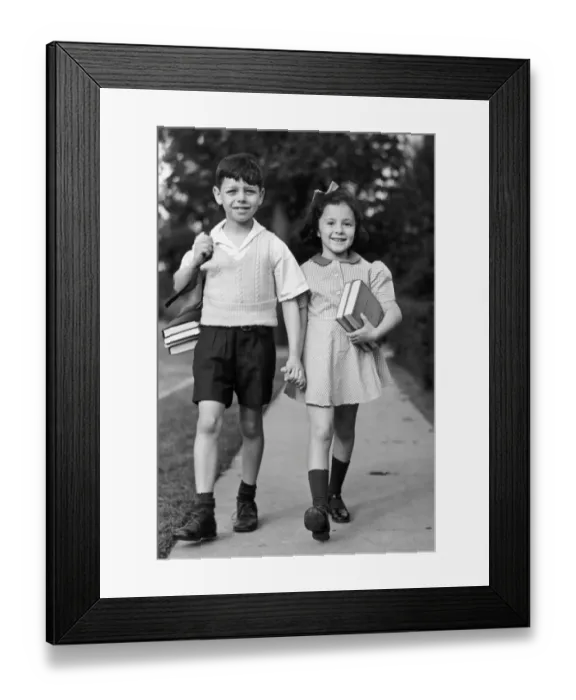Framed Print : Young girl & boy walking to school w / books Framed Print : Young girl & boy walking to school w / books