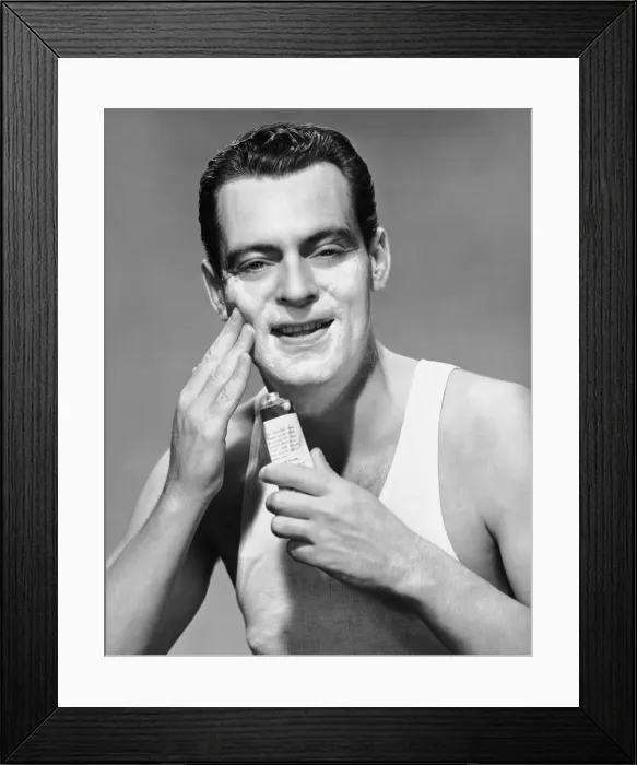 Framed Print : Man applying lotion Framed Print : Man applying lotion