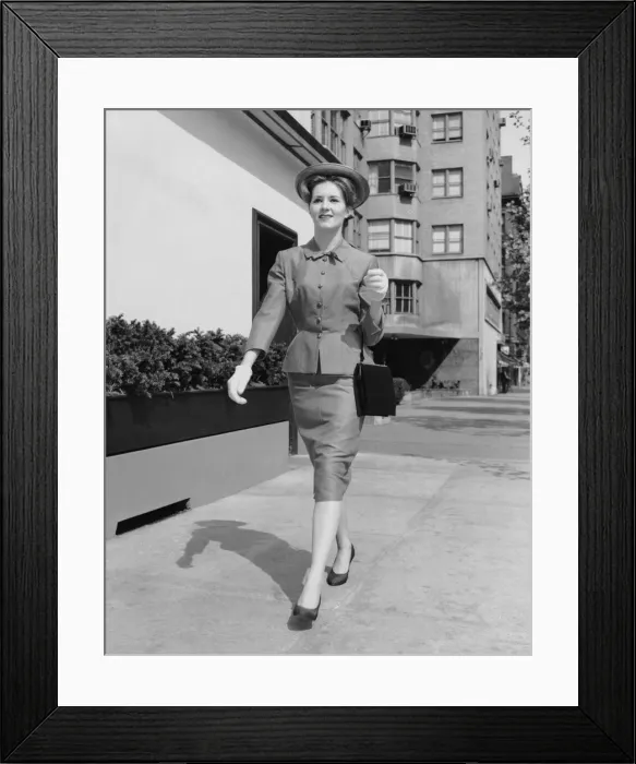 Framed Print : Woman walking down sidewalk Framed Print : Woman walking down sidewalk