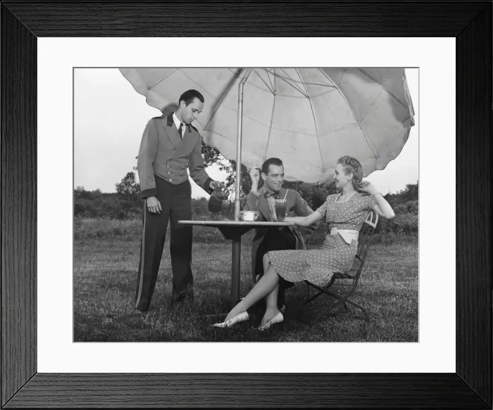 Framed Print : Couple being served by waiter Framed Print : Couple being served by waiter