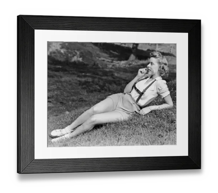 Framed Print : Portrait of woman in with flower in mouth Framed Print : Portrait of woman in with flower in mouth