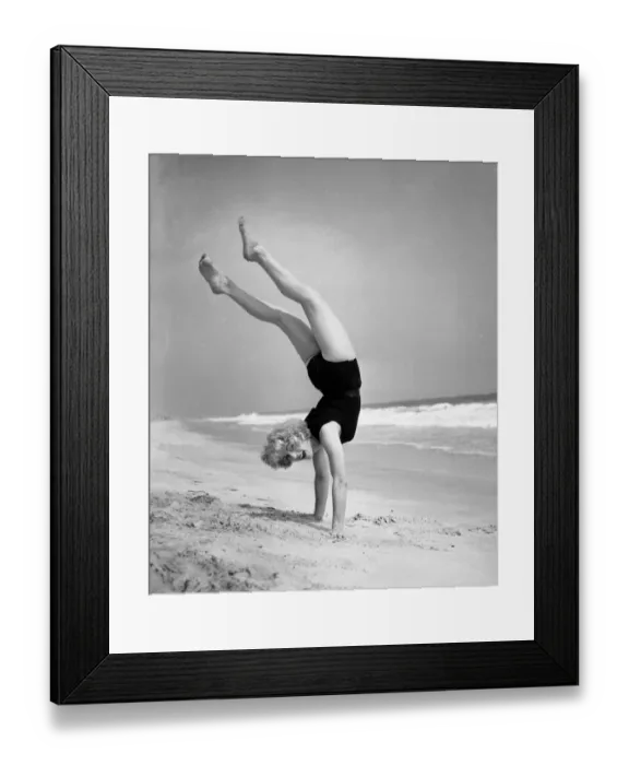 Framed Print : Woman does handstand on the beach (B&W) Framed Print : Woman does handstand on the beach (B&W)