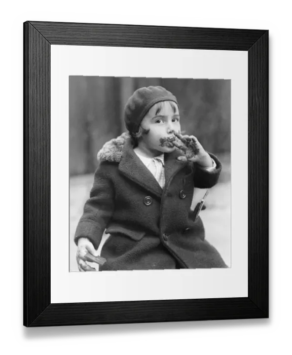 Framed Print : Girl (3-5) face and fingers covered in chocolate Framed Print : Girl (3-5) face and fingers covered in chocolate