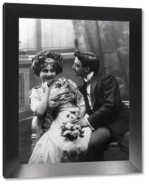 Courting. circa 1890: A courting Victorian couple fawning over each other