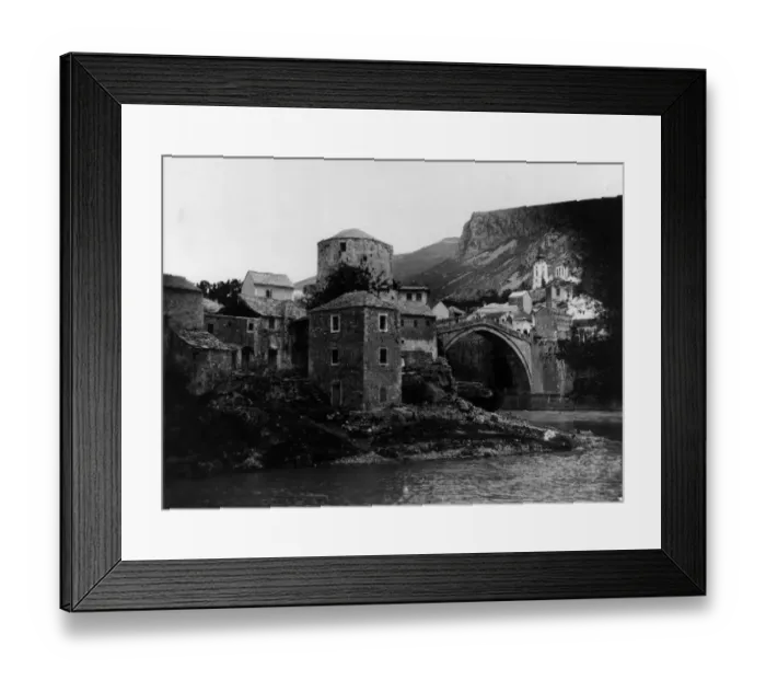 Framed Print : Mostar. circa 1910: The stone arch bridge over the River Neretva in the Framed Print : Mostar. circa 1910: The stone arch bridge over the River Neretva in the
