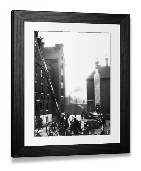 Framed Print : Fire. circa 1910: Firemen at work on a tall building Framed Print : Fire. circa 1910: Firemen at work on a tall building