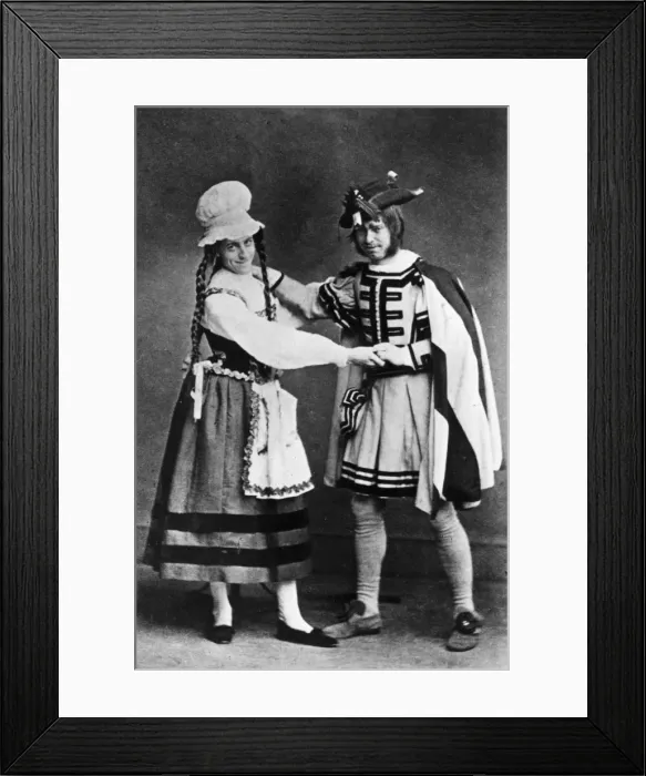 Framed Print : Pantomime. circa 1900: A pantomime dame and leading character, from an unknown production Framed Print : Pantomime. circa 1900: A pantomime dame and leading character, from an unknown production