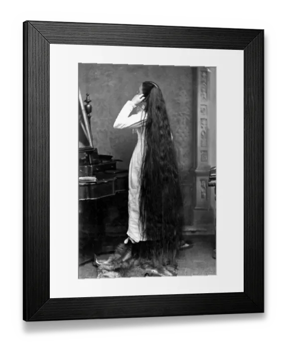 Framed Print : Long Hair. circa 1890: Miss Milo standing in front of a dressing-table Framed Print : Long Hair. circa 1890: Miss Milo standing in front of a dressing-table