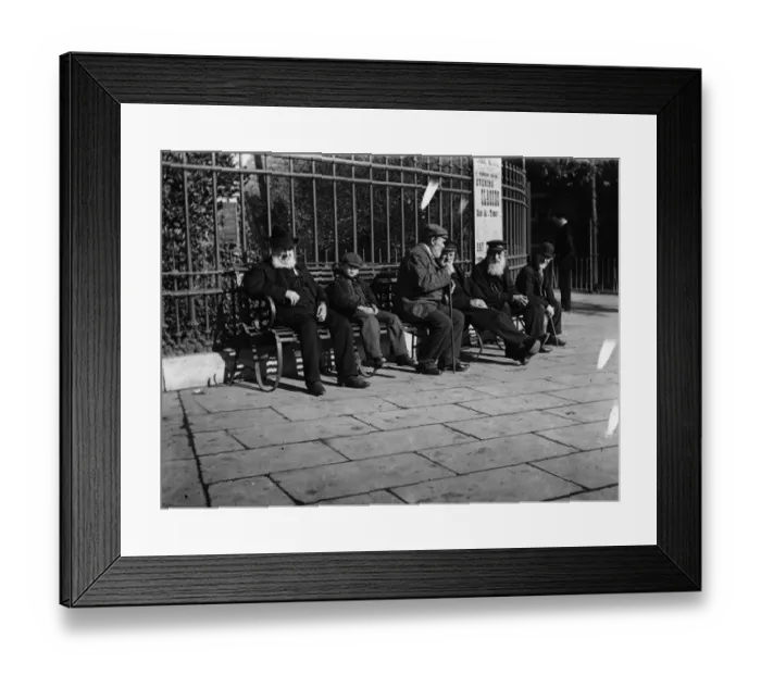 Framed Print : Old Men. circa 1900: A young boy sits on a bench next to a group of old Framed Print : Old Men. circa 1900: A young boy sits on a bench next to a group of old