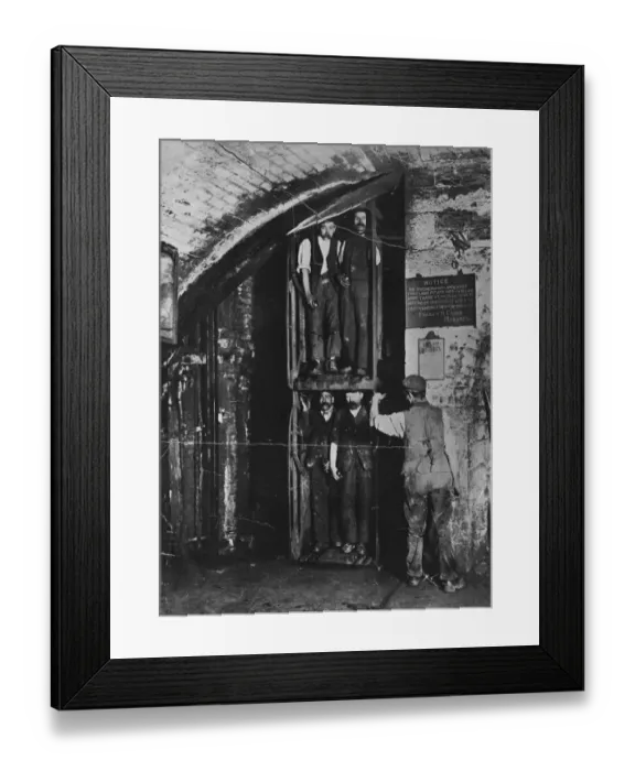 Framed Print : Going Up. circa 1900: Miners going up in the lift at the end of their shift Framed Print : Going Up. circa 1900: Miners going up in the lift at the end of their shift