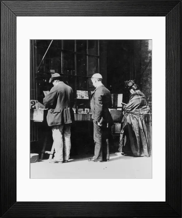 Framed Print : Bookstall. circa 1900: Customers browsing through some books at a bookstall Framed Print : Bookstall. circa 1900: Customers browsing through some books at a bookstall