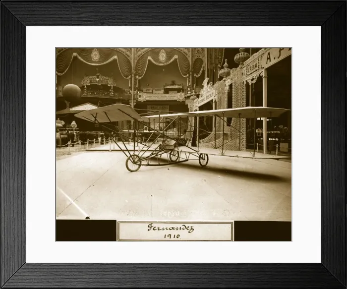 Framed Print : Fernandez. 25th September 1909: A Curtiss Pusher type biplane in an ornate exhibition hall Framed Print : Fernandez. 25th September 1909: A Curtiss Pusher type biplane in an ornate exhibition hall
