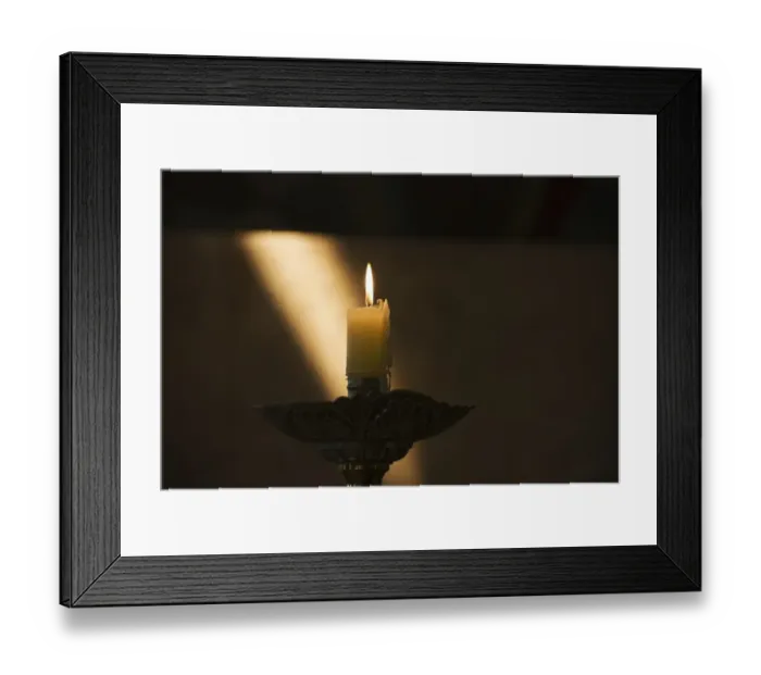 Framed Print : Candle Burning With Sun Ray On The Wall In The Background Framed Print : Candle Burning With Sun Ray On The Wall In The Background