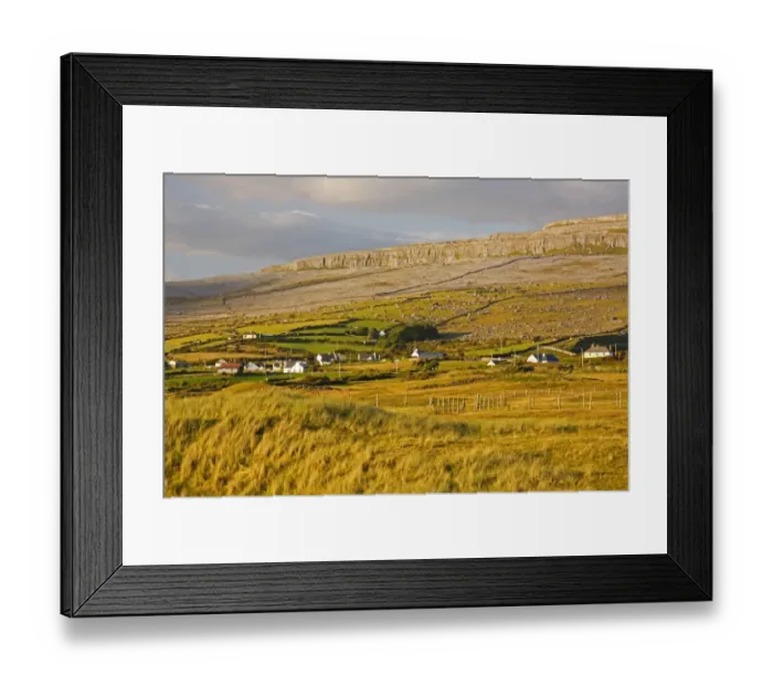 Framed Print : View Of Fanore Village And Limestone Mountain In The Background In The Burren Region Framed Print : View Of Fanore Village And Limestone Mountain In The Background In The Burren Region
