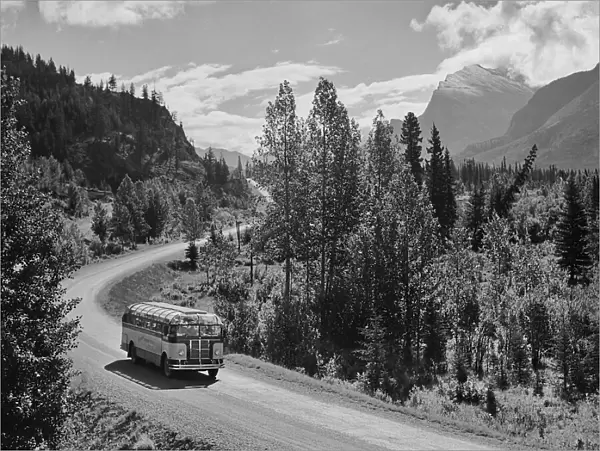 Tour Bus. A Skyline Tours bus on a road through the mountains circa 1950