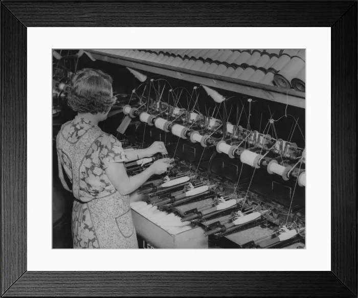 Framed Print : Quilling. A female worker quilling at a textile mill, USA, circa 1930 Framed Print : Quilling. A female worker quilling at a textile mill, USA, circa 1930