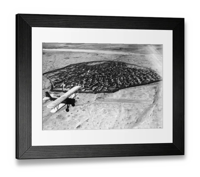 Framed Print : Biplane over Baghdad, Iraq Framed Print : Biplane over Baghdad, Iraq