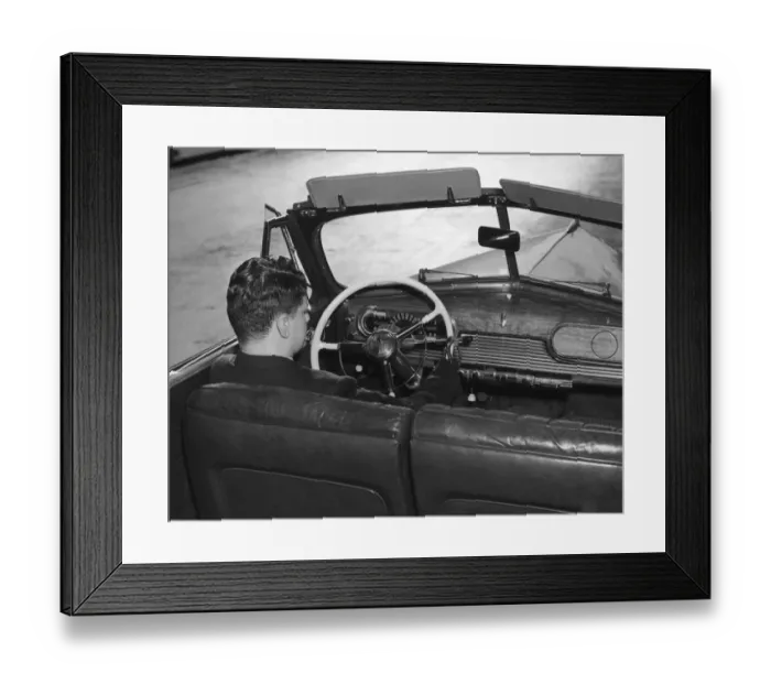 Framed Print : New Hands. A man named Wenger uses his artificial hands to drive his Oldsmobile Framed Print : New Hands. A man named Wenger uses his artificial hands to drive his Oldsmobile