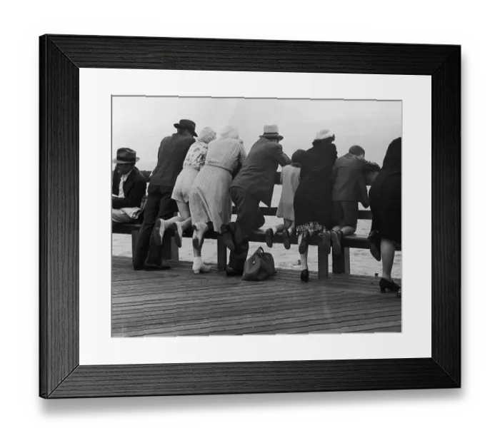 Framed Print : Sea Front. Visitors to the seafront watch a couple of swimmers in the water, circa 1940 Framed Print : Sea Front. Visitors to the seafront watch a couple of swimmers in the water, circa 1940