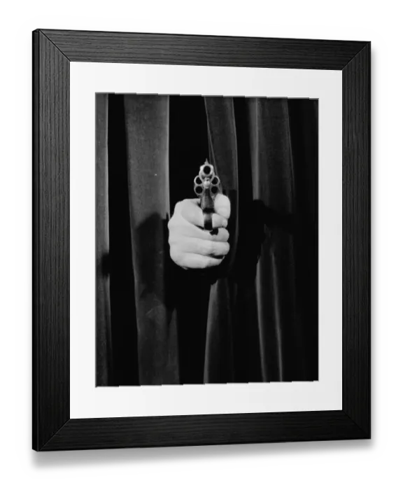 Framed Print : Gun poking out from behind curtain Framed Print : Gun poking out from behind curtain