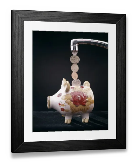 Framed Print : Money Pouring Into Piggy Bank Framed Print : Money Pouring Into Piggy Bank