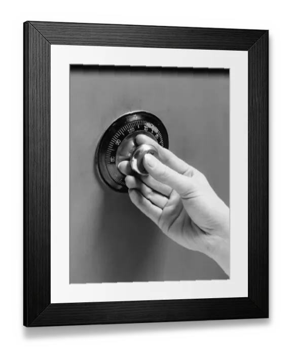 Framed Print : Woman turning combination lock Framed Print : Woman turning combination lock