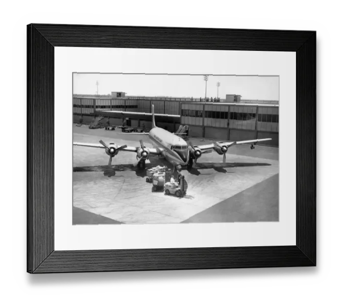 Framed Print : Luggage being unloaded from airplane Framed Print : Luggage being unloaded from airplane