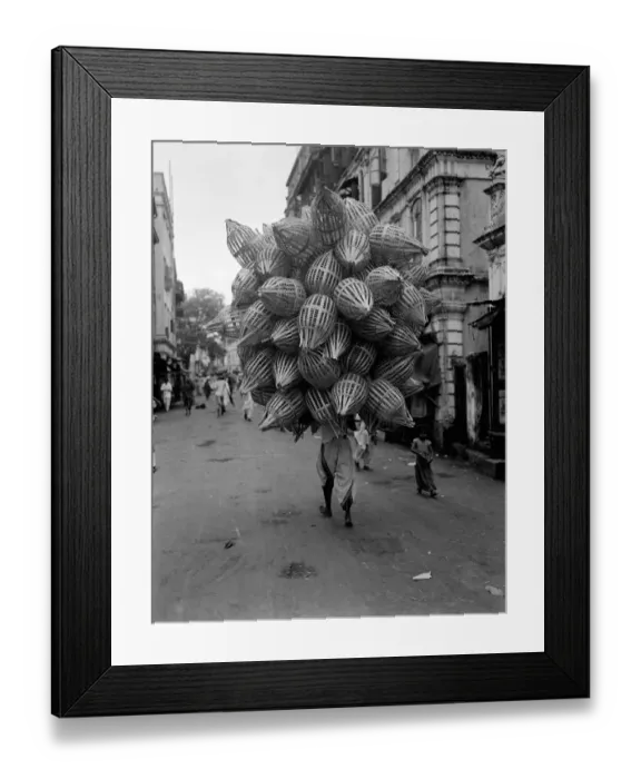 Framed Print : Man carrying baskets Framed Print : Man carrying baskets