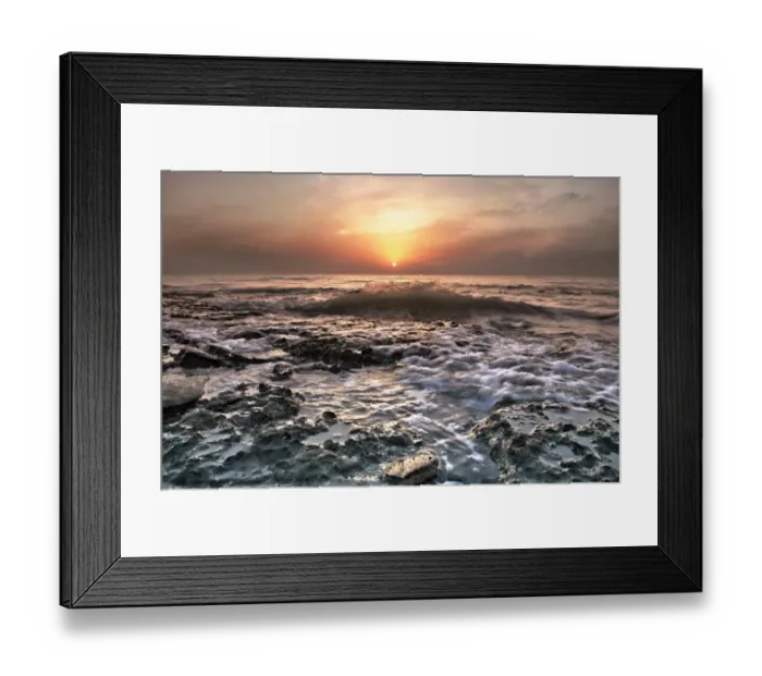 Framed Print : Water washing over rocks on beach Framed Print : Water washing over rocks on beach
