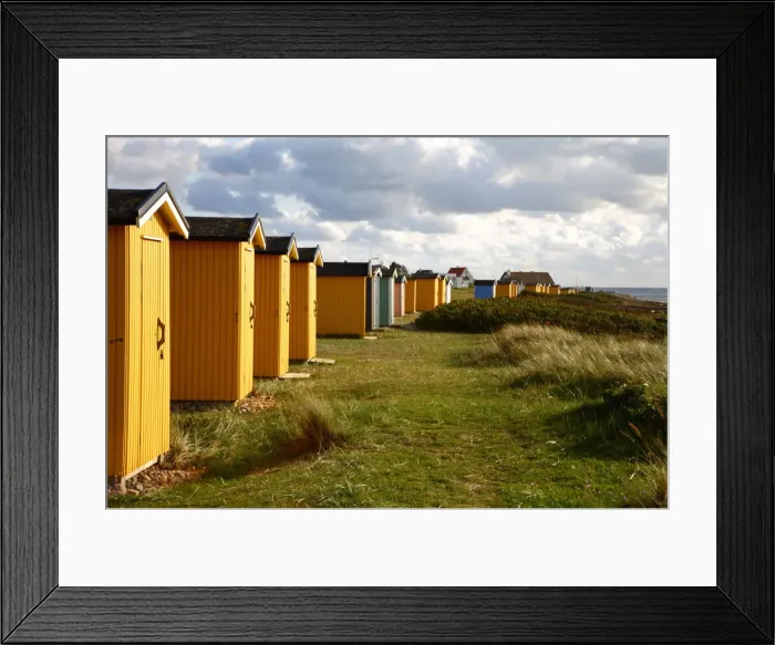 Framed Print : Colorful huts in grassy field Framed Print : Colorful huts in grassy field