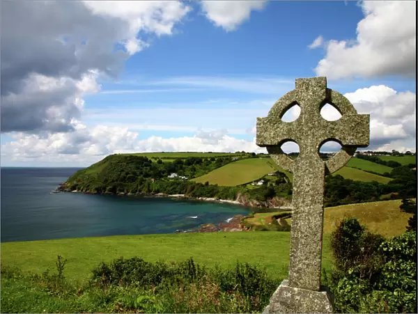 Old cross in coastal landscape