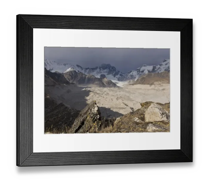 Framed Print : Snowy mountains overlooking dusty valley