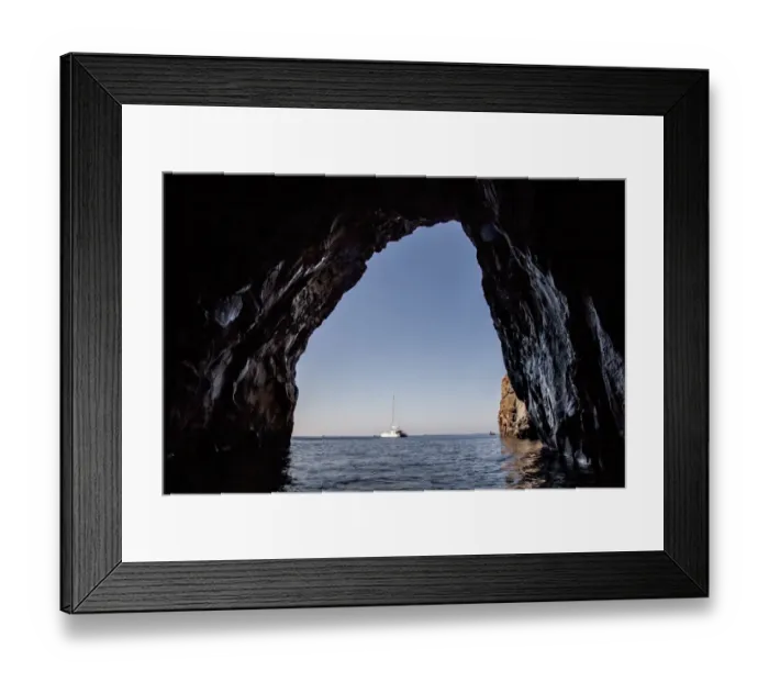 Framed Print : Sailboat viewed from cave in ocean Framed Print : Sailboat viewed from cave in ocean