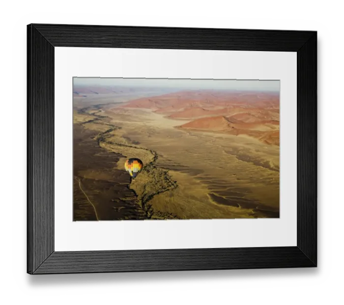 Framed Print : Hot air balloon over desert landscape Framed Print : Hot air balloon over desert landscape